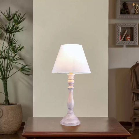 Modern BARMAK Table Lamp on a stylish desk, providing elegant lighting for home decor.