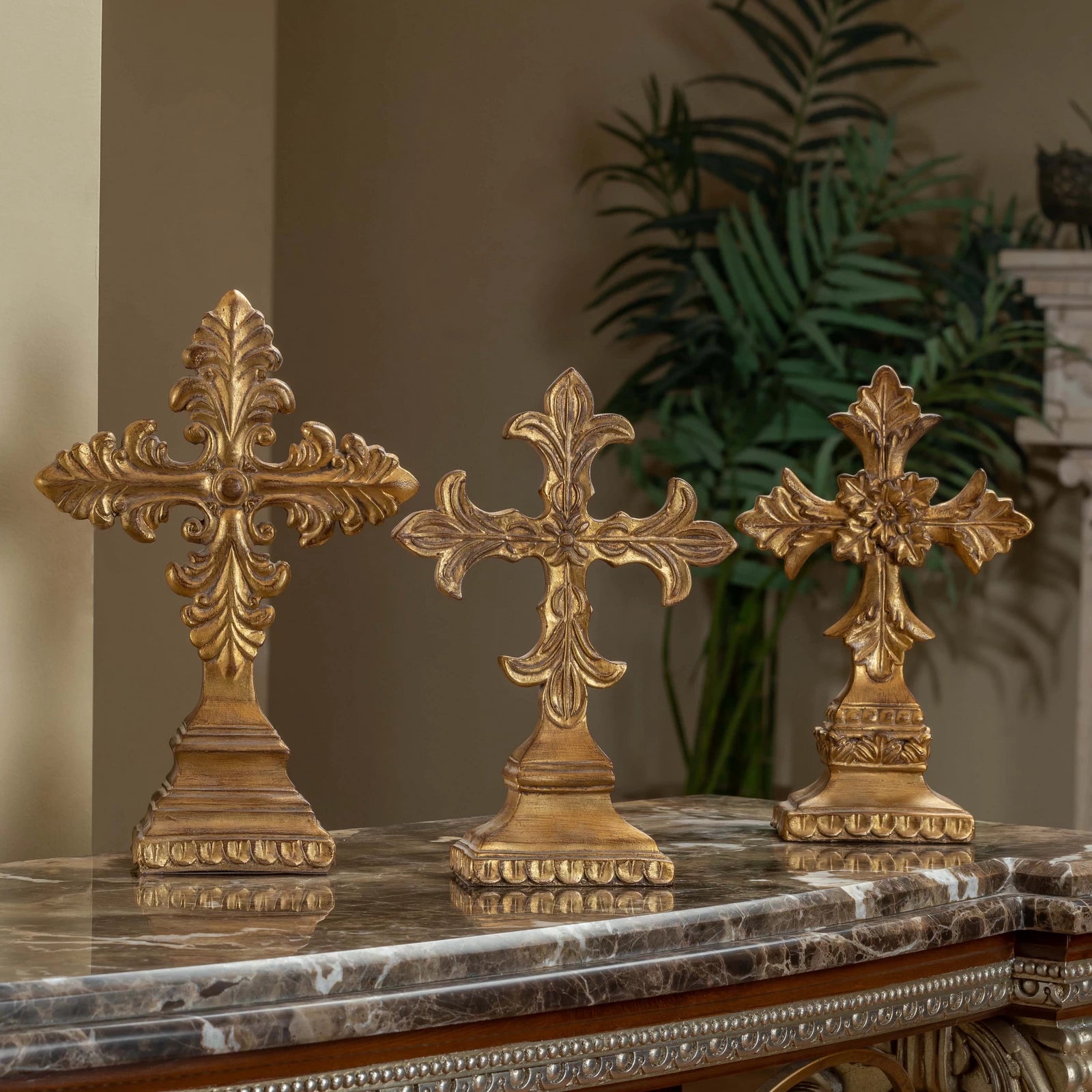 Classic decorative crosses used as table accessories, featuring intricate design and a timeless aesthetic, styled on a tabletop display.


