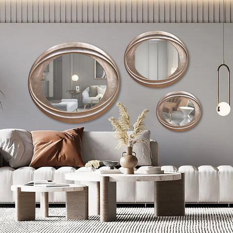 "Modern I Twist Mirrors Group of 3 from Daleenz Store, featuring three sleek vertical mirrors with a subtle twist design, styled on a modern living room wall."

