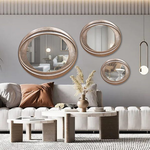 Set of 3 Modern I TWIST wall mirrors featuring abstract, curved designs with sleek frames arranged in a decorative pattern.

