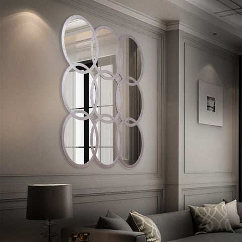 "Modern Olympic 9 Mirror from Daleenz Store featuring a bold, multi-circle sculptural design in a sleek finish, mounted on a modern interior wall."


