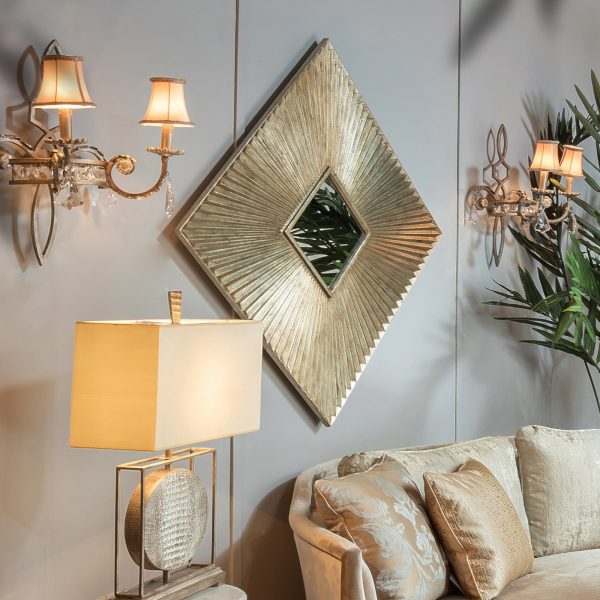 Modern Squar Shooaa Mirror with geometric, radiant frame design mounted on a wall, adding depth and modern flair to the room.


