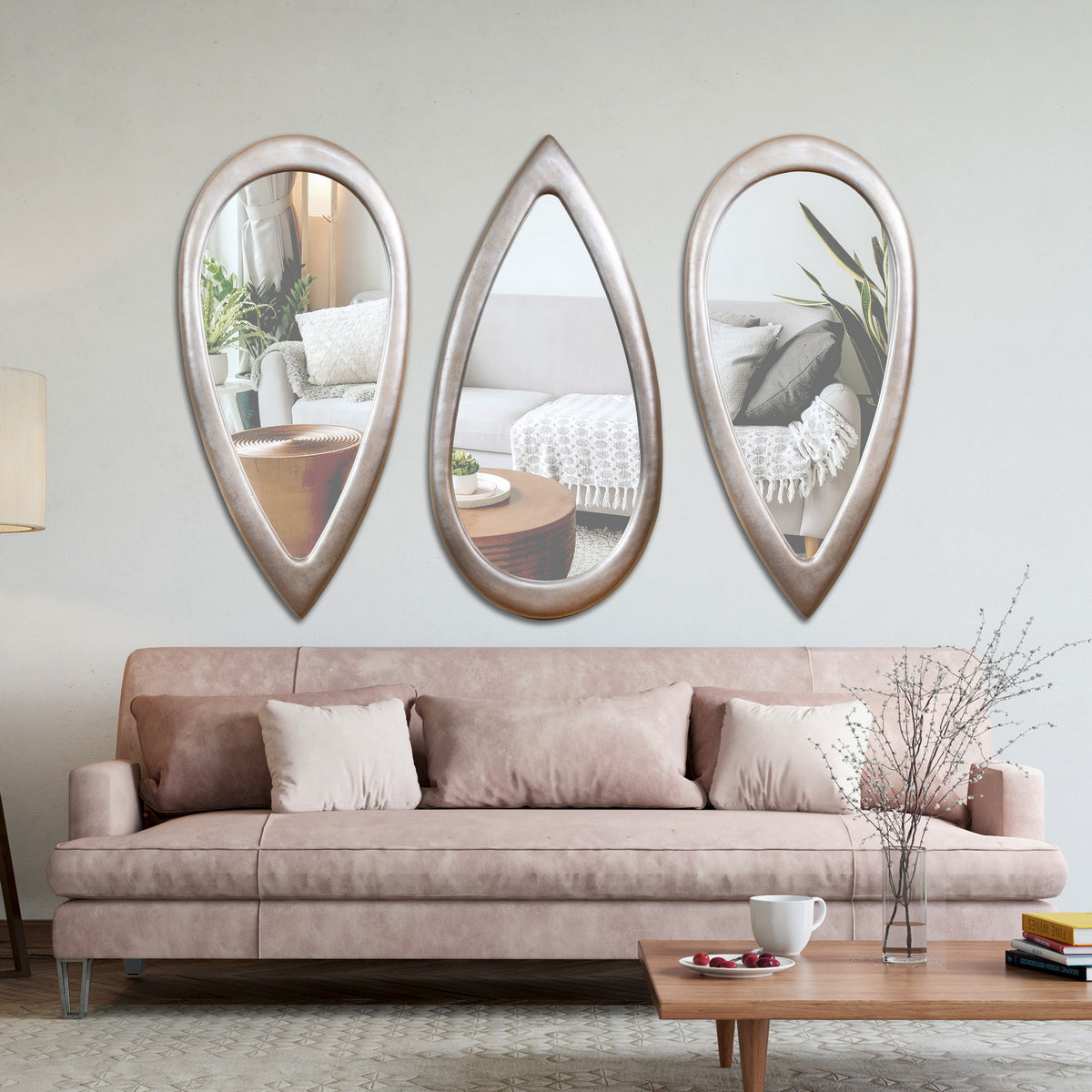 "Modern Tear Drop Mirror from Daleenz Store with a smooth teardrop shape, mounted on a neutral-toned wall in a contemporary interior setting."

