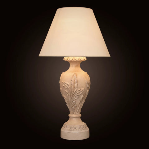 Modern Table Lamp Forest with minimalist tree-inspired design, softly glowing on a wooden nightstand in a cozy living room setting.

